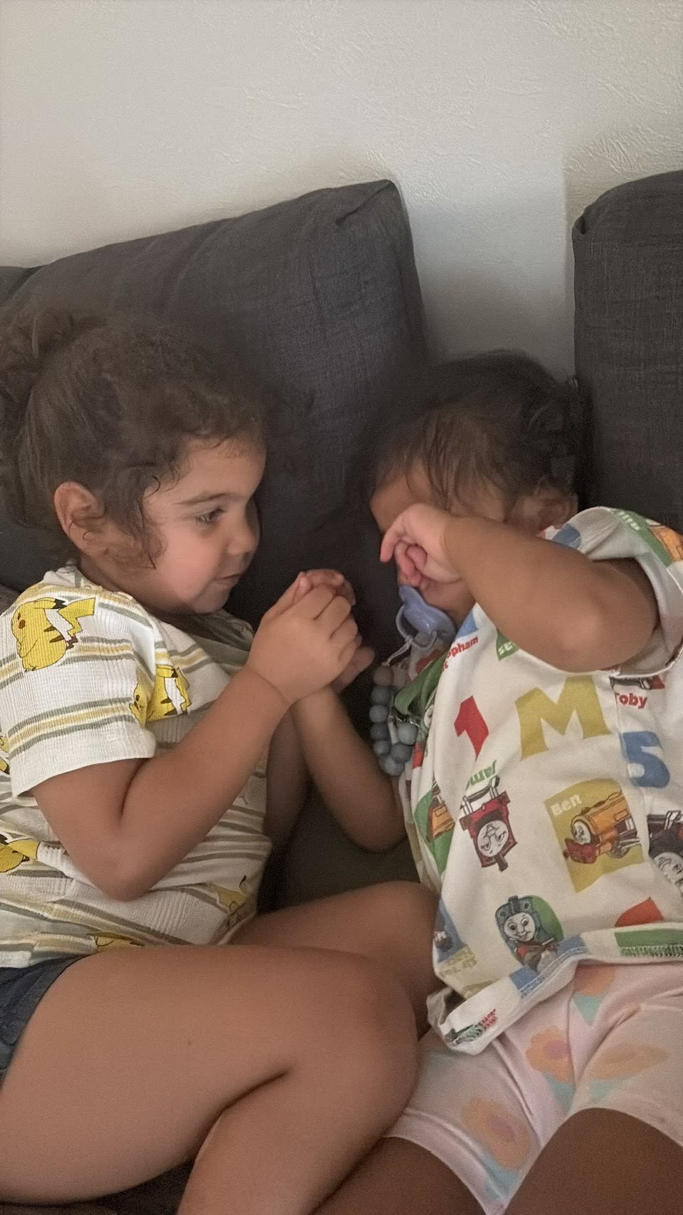 Siblings quiet moment on the couch in Tokyo