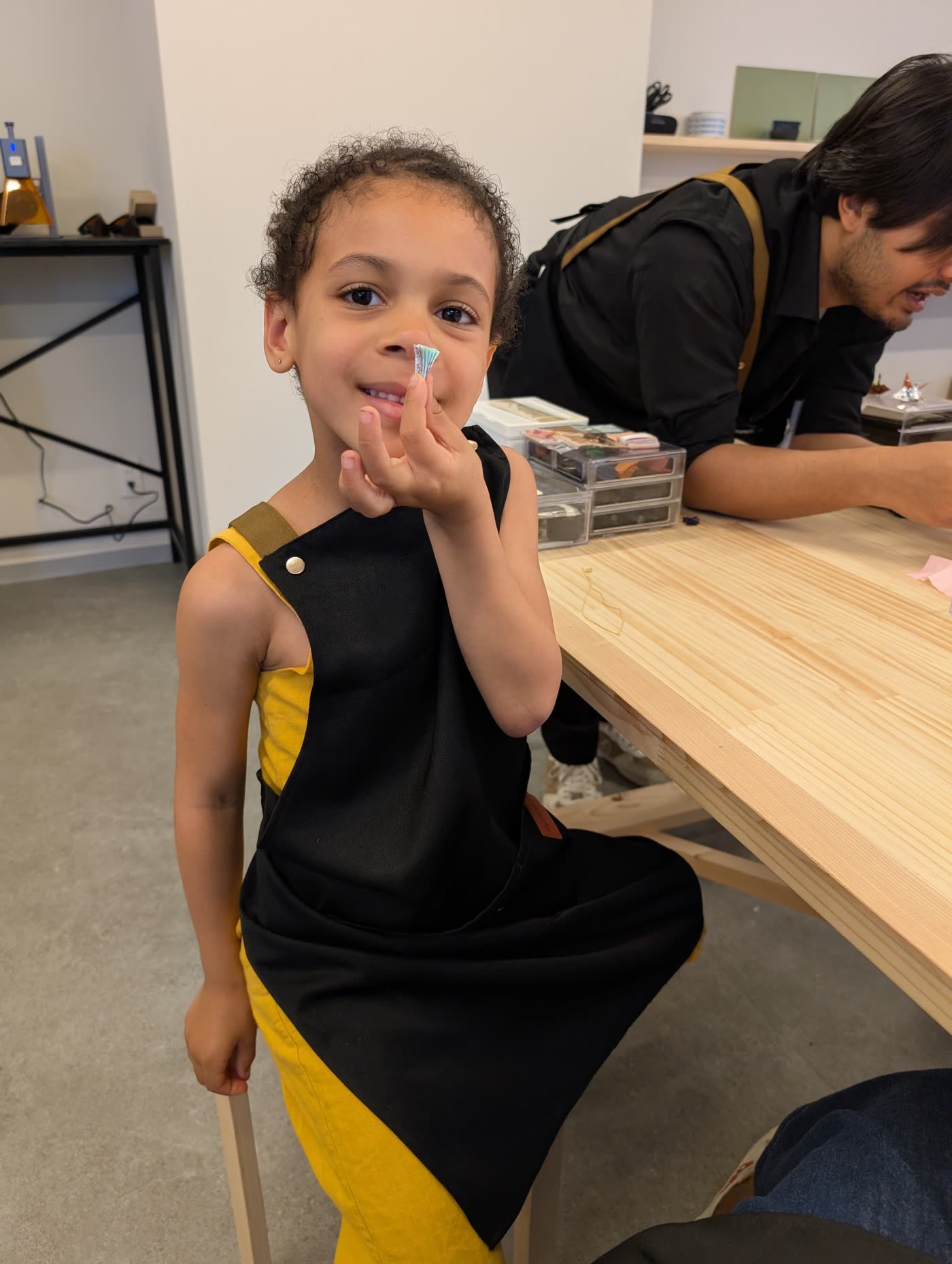 Little girl smiling at a Japanese craft workshop