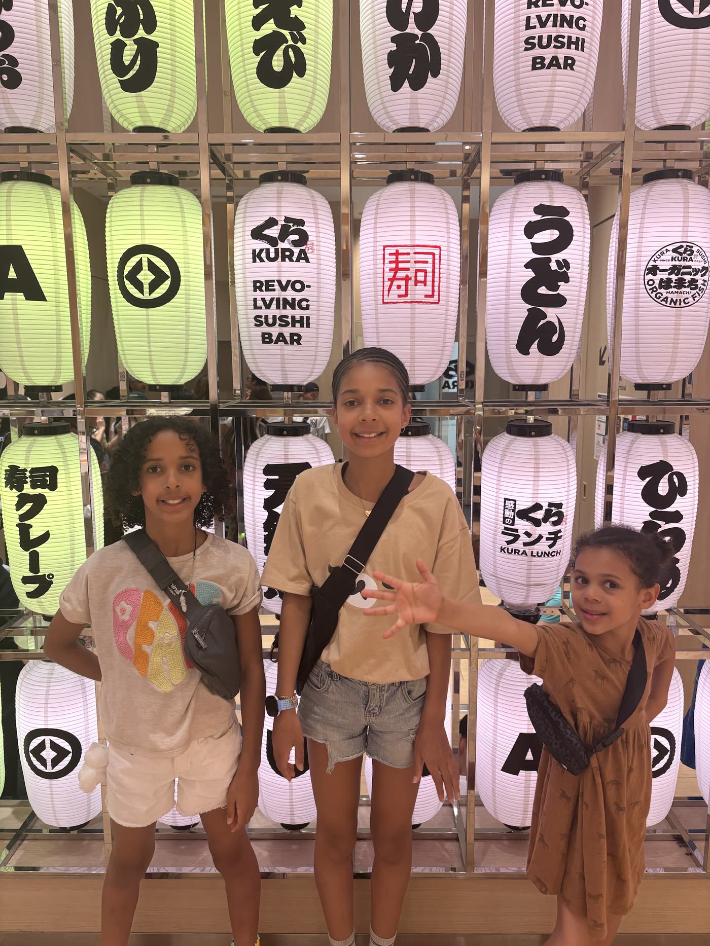 Three sisters at Kura Sushi in Tokyo with SAIGROWTH